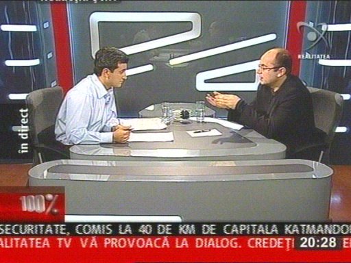 Mice teeth appear on the text in this image from a romanian talkshow because the text scrolls from right to left (click to enlarge)
